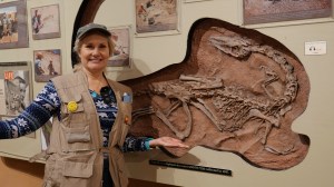 Shelley Carney with a Coelophysis fossil