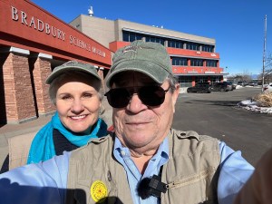 Shelley Carney and Toby Younis in front of the Bradbury Science Museum in Los Alamos
