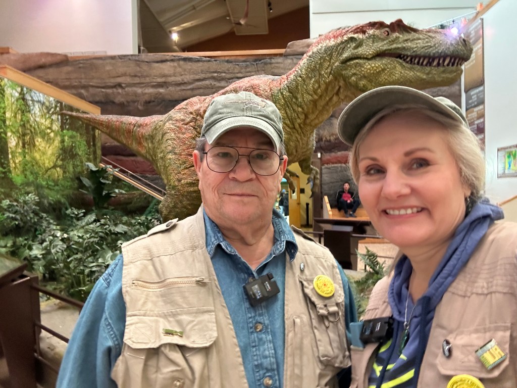 Toby Younis and Shelley Carney in front of the Bisti Beast at the New Mexico Museum of Natural History and Science