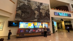 Shelley Carney reading the Earthquake exhibit information
