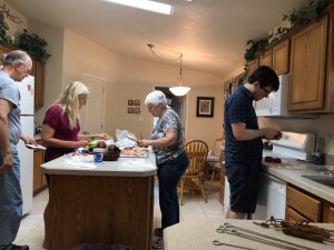a family cooking dinner together