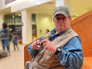 Toby Younis holds an action camera