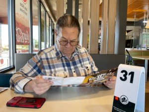 Toby planning a day trip over breakfast