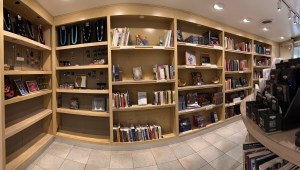 Shelves in a museum gift shop filled with books and jewelry
