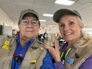 Toby Younis and Shelley Carney display a rock at the Albuquerque Gem and Mineral show