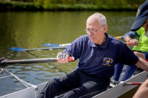 Older man rowing a boat